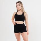 Women's crossover sports bra in Black — ALKALINE